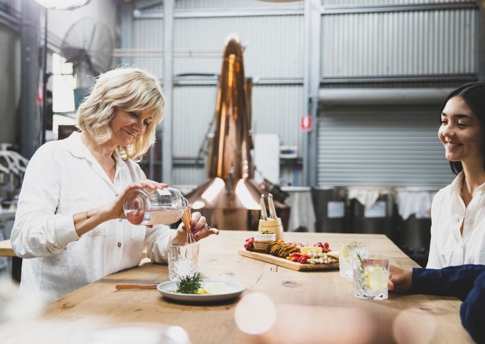 Gin maker Kylie Sepos creating a gin cocktail at The Farmer's Wife Distillery, Allworth