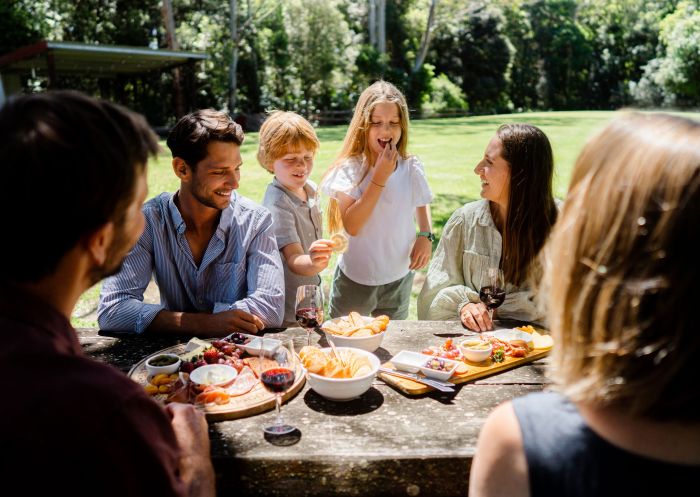  Family and friends enjoying food and drink, Great Lakes Paddocks, Wootton