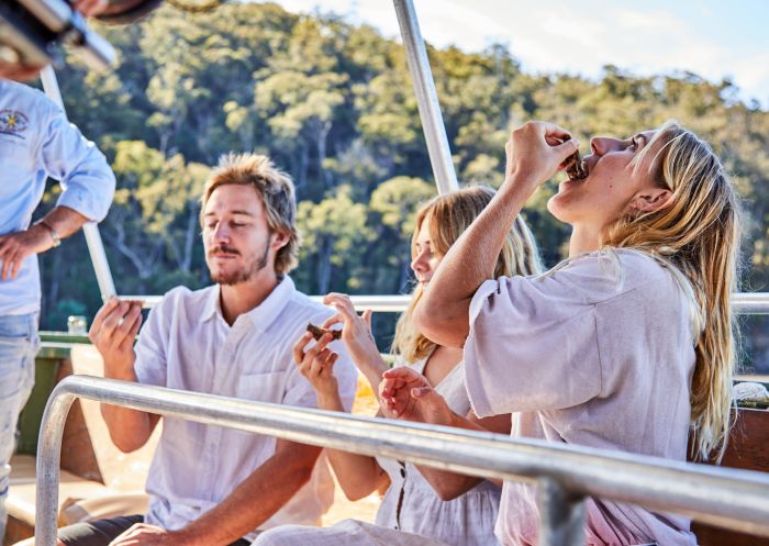 Friends enjoying oysters, Captain Sponge's Magical Oyster Tour, Pambula 