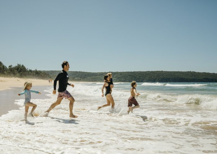  Family enjoying a swim, Aslings Beach, Eden