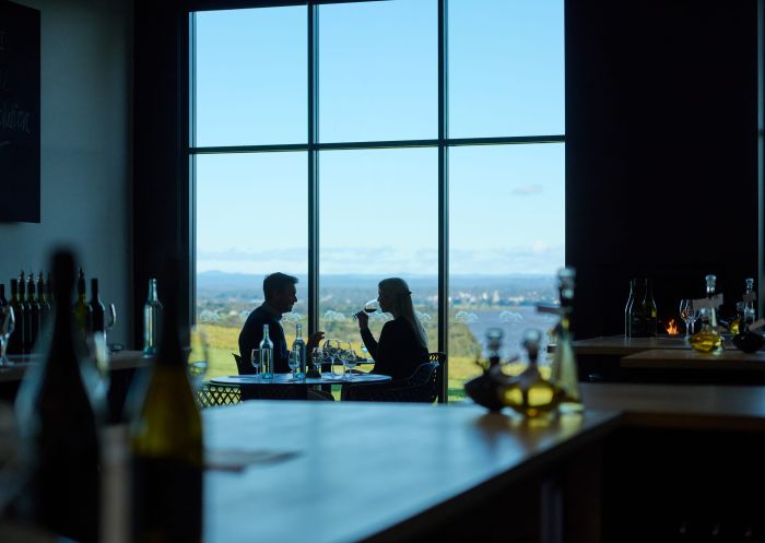Couple enjoying wine with a view, Two Figs Winery, Berry - Credit: Tourism Australia