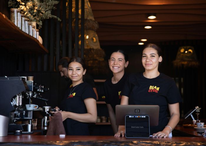 Three staff at counter. Blak Cede Gunyah Café and Shop, Nowra - Credit: Smiling Sun | Blak Cede
