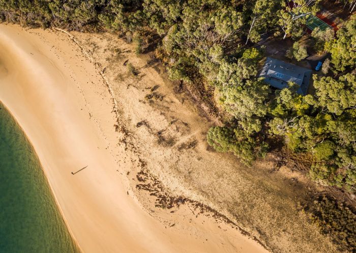 Aerial view of house near beach, Myer House, Mimosa Rocks National Park - Credit: John Spencer | DCCEEW
