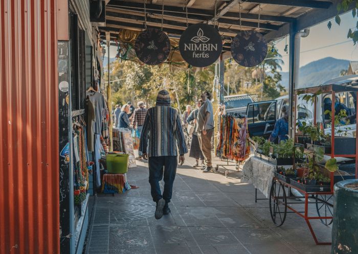 Man walking through street full of shops in Nimbin - Credit:  Lismore City Council