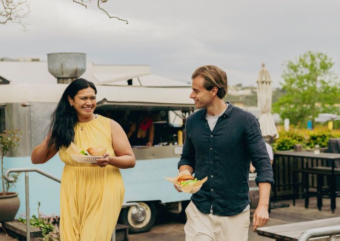 Couple enjoying food at Dulcie’s Cottage, Merimbula