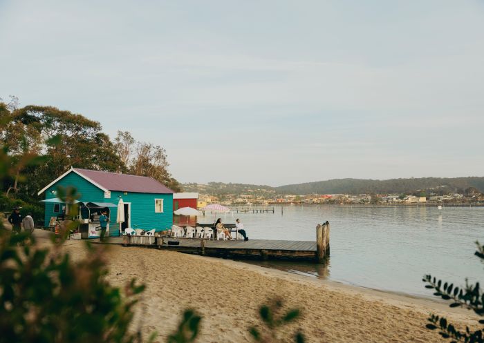 Couple enjoying a morning coffee, Mitchies Jetty and Cafe, Merimbula