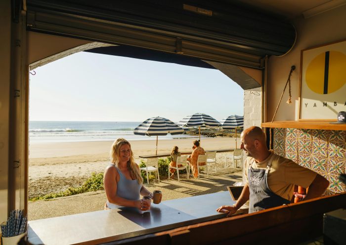 Woman ordering coffee at The Kiosk Yamba and smiling with barista, The Kiosk Yamba, Yamba - Credit: My Clarence Valley