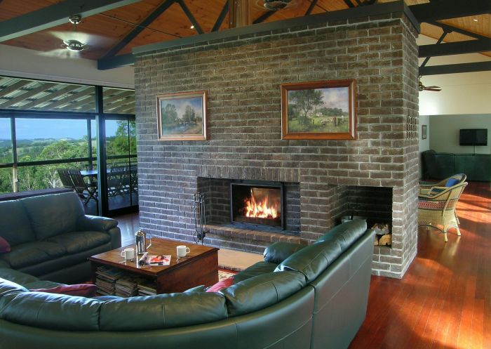 Doubled-sided fireplace in Brumby's lounge, Banjos Bushland Retreat, Vacy - Credit: Banjos Bushland Retreat 