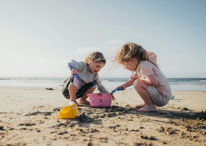 Kids on beach digging sand, Holiday Haven Currarong, Currarong - Credit: Josh Brnjac