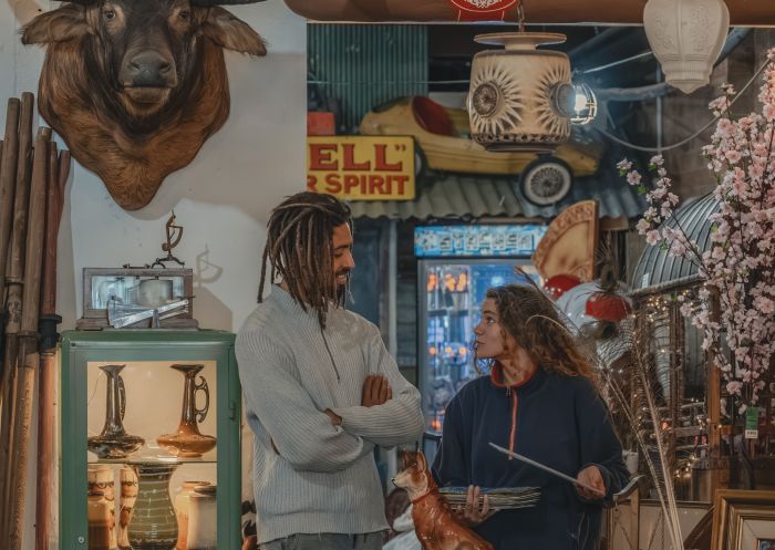 Two people talking inside shop, Two Ravens Antiques & Collectables, Lismore - Credit: Lismore City Council