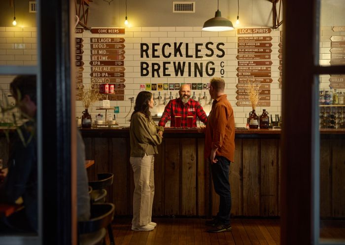 Couple enjoying a drink at the Reckless Brewing Co bar and restaurant in the historic mill precinct