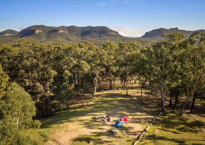 Campers enjoying a scenic view at Private Town campground, Yerranderie Regional Park - Credit: John Spencer | DCCEEW
