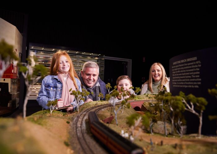 Family enjoying scale model train at the Bathurst Rail Museum, Bathurst