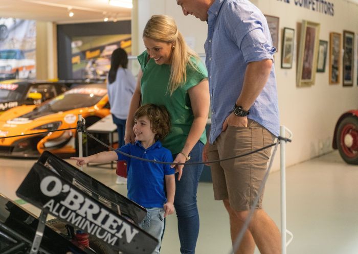 Family enjoying the National Motor Racing Museum at Murray's Corner, Bathurst