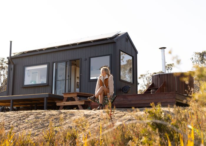 A lady sitting on the front deck of Tiny Billy from Into the Wild Escapes, Clarence - Credit: Into the Wild Escapes