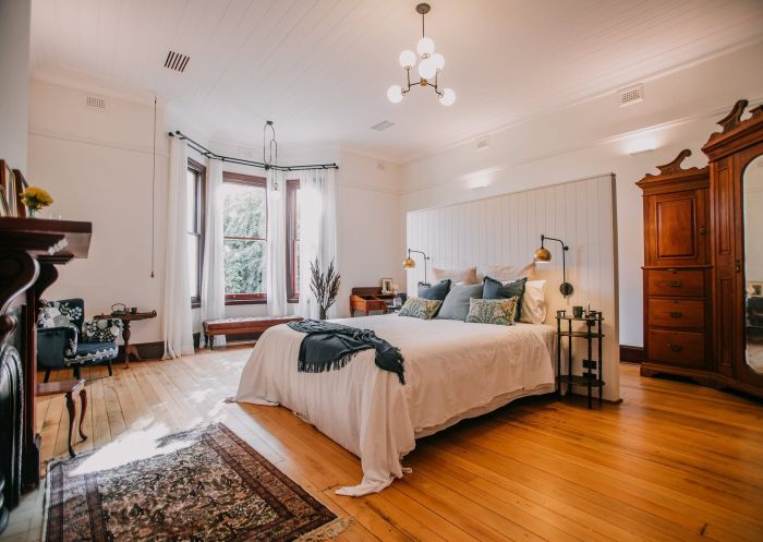 A luxury bedroom suite with wooden floors and a bay window at the Littlebourne Guest House, Kelso - Credit: Bathurst Regional Council