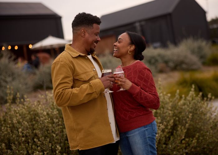 Couple enjoying a drink in the beer garden at Small Batch Brewery, Mudgee