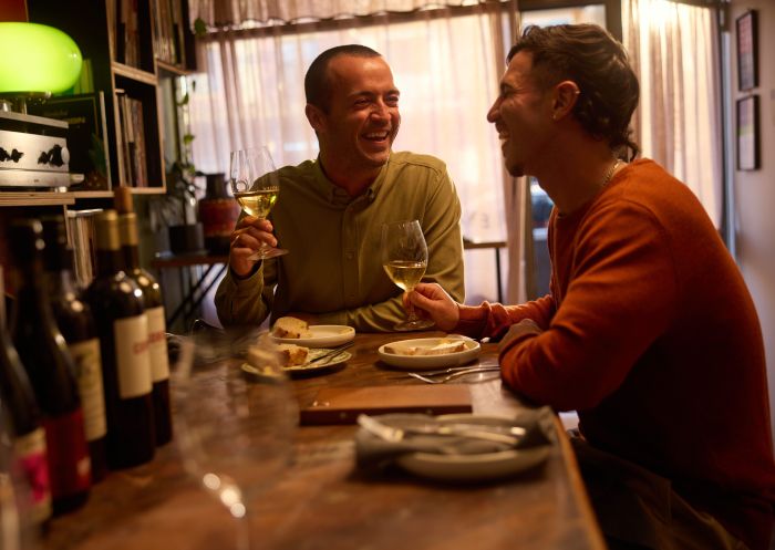 Couple enjoying drinks and food at Hey Rosey, Orange