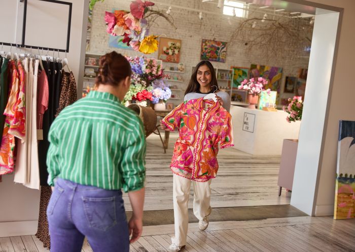 Friends shopping at the colourful homewares store Jumbled in Orange