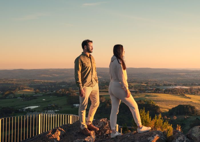 Couple enjoying the sunrise from Pinnacle Lookout, Canobolas