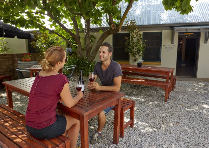 A couple enjoying a glass of wine at the Union Bank wine bar and dining, Orange