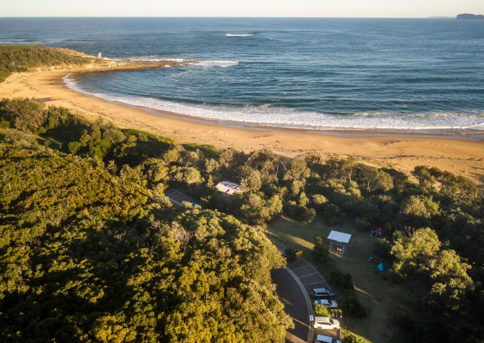 Aerial view of beachfront, Putty Beach Campground, Bouddi National Park - Credit: John Spencer | DCCEEW