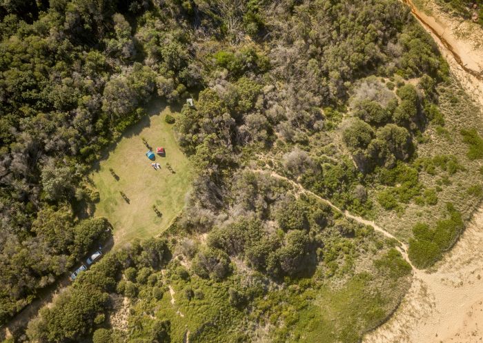 Aerial photo, Tallow Beach campground, Bouddi National Park - Credit: John Spencer | DCCEEW