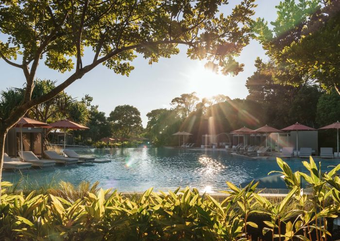 View of the resort pool with a shimmering afternoon sun at Elements of Byron, Byron Bay - Credit: Elements of Byron