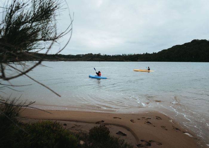 Couple kayaking along Tuross Lake, Tuross Head