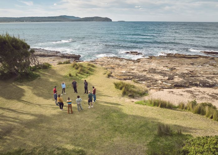 People participating in an immersive experience with a welcome to Yuin country run by Ngaran Ngaran Culture Awareness, South Durras