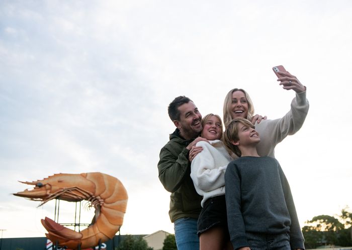 Family taking a photo, Big Prawn, Ballina