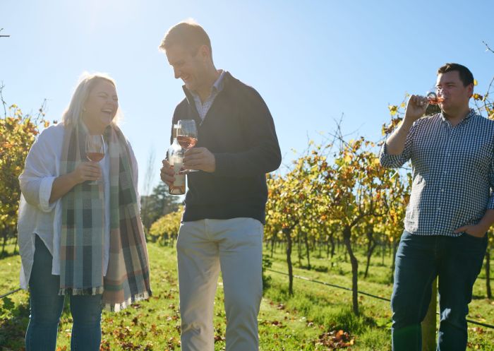 A couple and guide enjoy a tour of the vineyards at Bendooley Estate, Berrima
