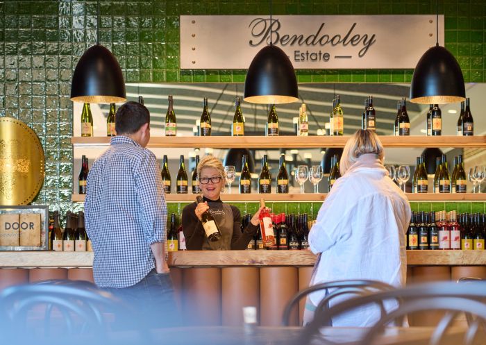 A couple enjoys food and wine, Bendooley Estate, Berrima