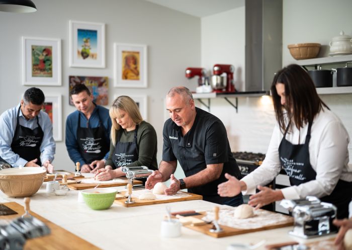 A small class enjoying an Italian cooking experience with Stefano Marvello located in Bowral, Southern Highlands