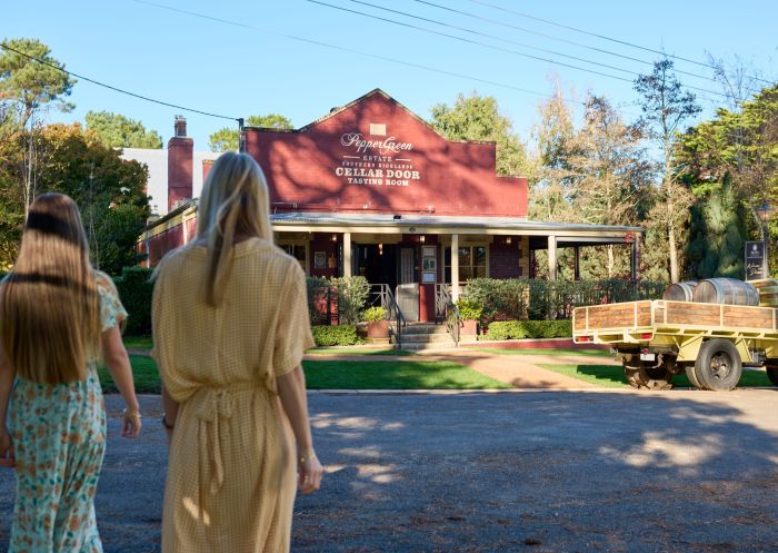 Friends walking to iconic heritage building, PepperGreen Estate, Berrima