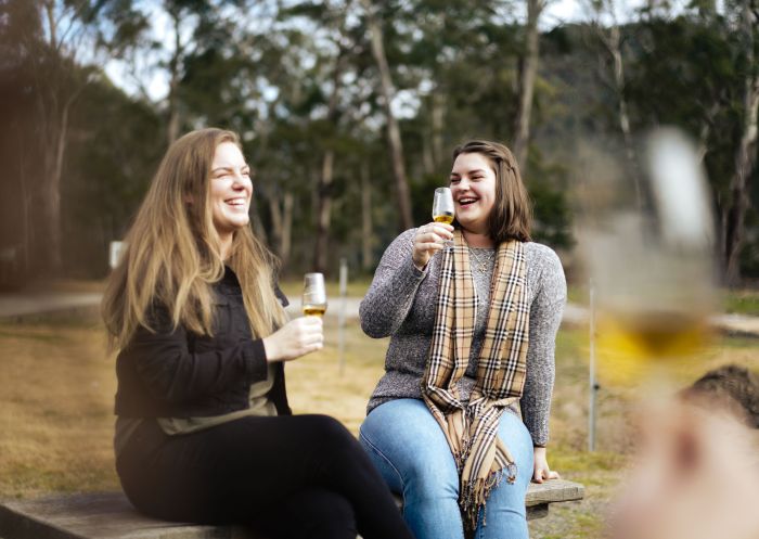 Friends enjoying a drink at Joadja Distillery, Joadja