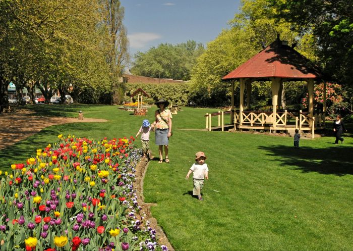 Mother and toddlers walking along a row of tulips in the colourful Leighton Gardens, Moss Vale - Credit: Destination Southern Highland