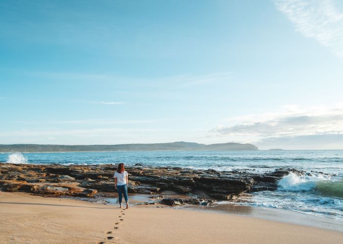 Woman standing near rocks, Rocks near beach, South Durras - Credit:  Eurobodalla Coast Tourism