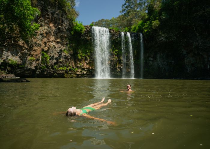 Couple enjoying a refreshing swim, Dangar Falls, Dorrigo