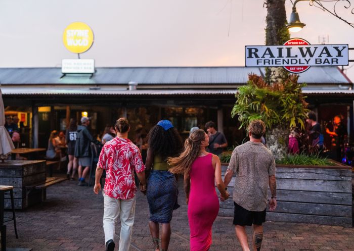 Friends enjoy an evening out at the Railway Friendly Bar, Byron Bay