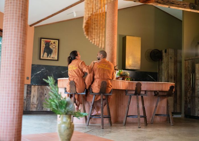Couple enjoying breakfast at the bar, Sun Ranch, Coopers Shoot 