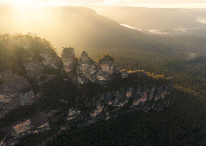 Golden sun rays filtering through the misty valley, Three Sisters, Katoomba 