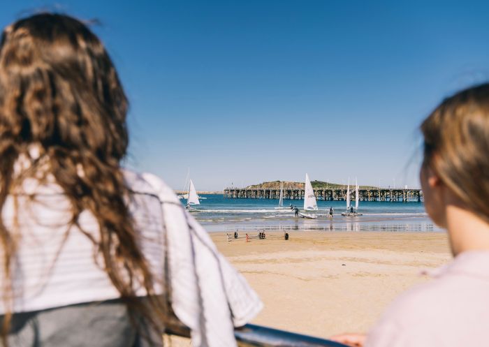 Friends watching windsurfers, Jetty Beach, Coffs Harbour