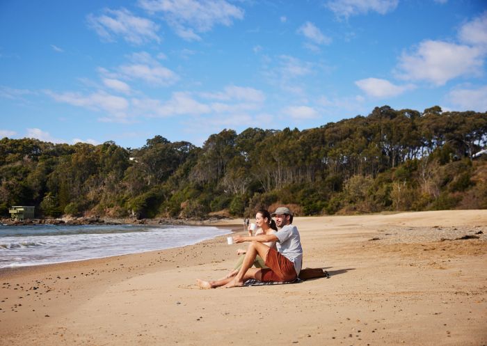 Couple enjoying a picnic, Charlesworth Bay Beach Resort, Coffs Harbour