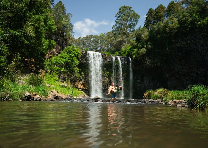 Couple enjoying a refreshing swim, Dangar Falls, Dorrigo