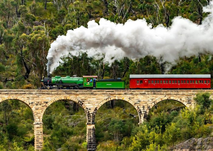A steam train crossing a bridge with arches at Zig Zag Railway, Clarence - Credit: Zig Zag Railway