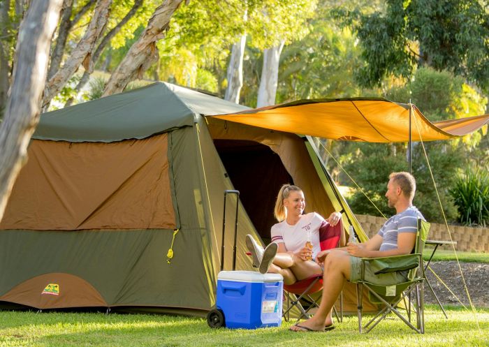 Couple camping sitting outside tent, BIG4 Sawtell Beach Holiday Park. Sawtell - Credit: Coffs Coast State Park
