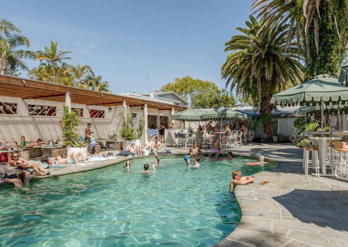 Guests enjoying the swimming pool, and hanging by the pool bar, Wake Up! Byron Bay, Byron Bay - Credit: Wake Up! Hostels