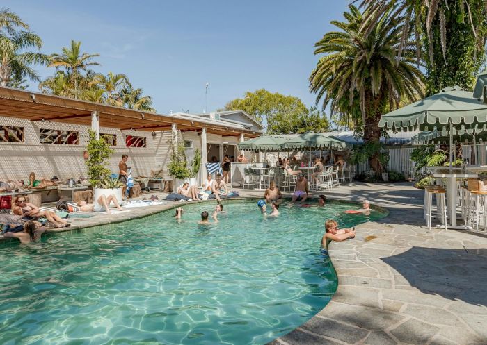 Guests enjoying the swimming pool, and hanging by the pool bar, Wake Up! Byron Bay, Byron Bay - Credit: Wake Up! Hostels