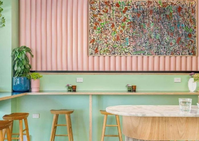 Pastel coloured cafe interior with bar and stools at Enso Specialty Coffee, Bathurst - Credit: Bathurst Visitor Information Centre